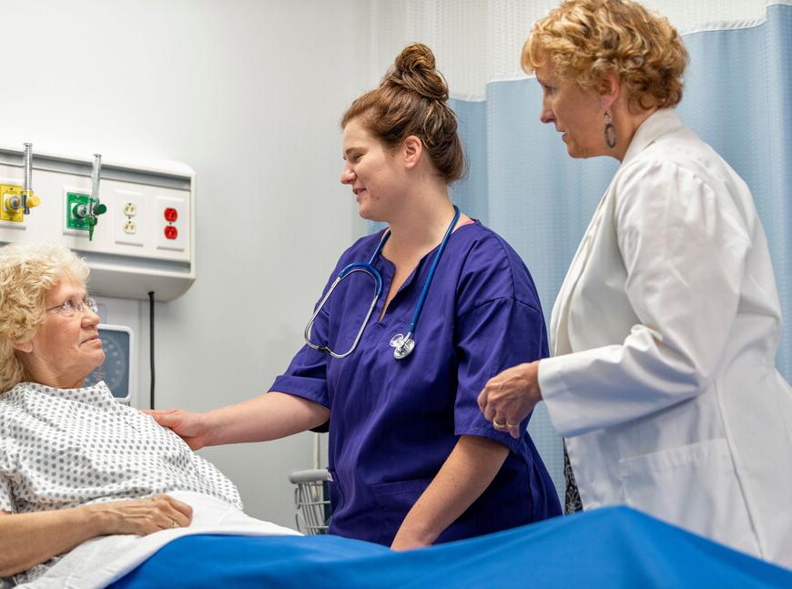 Nurses working with patient 