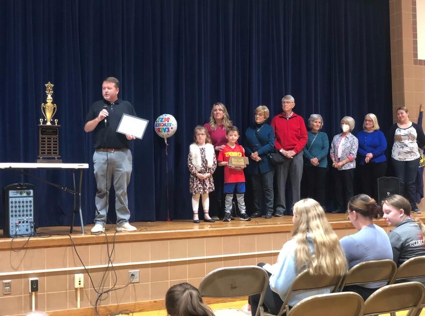 Jason Krueger receives award at Park Middle School.