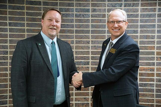 NWU President Darrin Good shaking hands with Central Community College President Matt Gotschall