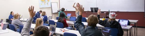 Professor Megan Winchell in front of a class of students.