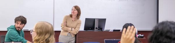 Professor Megan Winchell in front of a class of students.